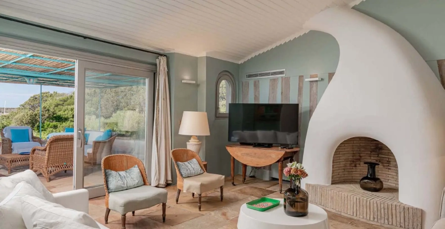 Outdoor lounge with sofas overlooking the Costa Smeralda coastline